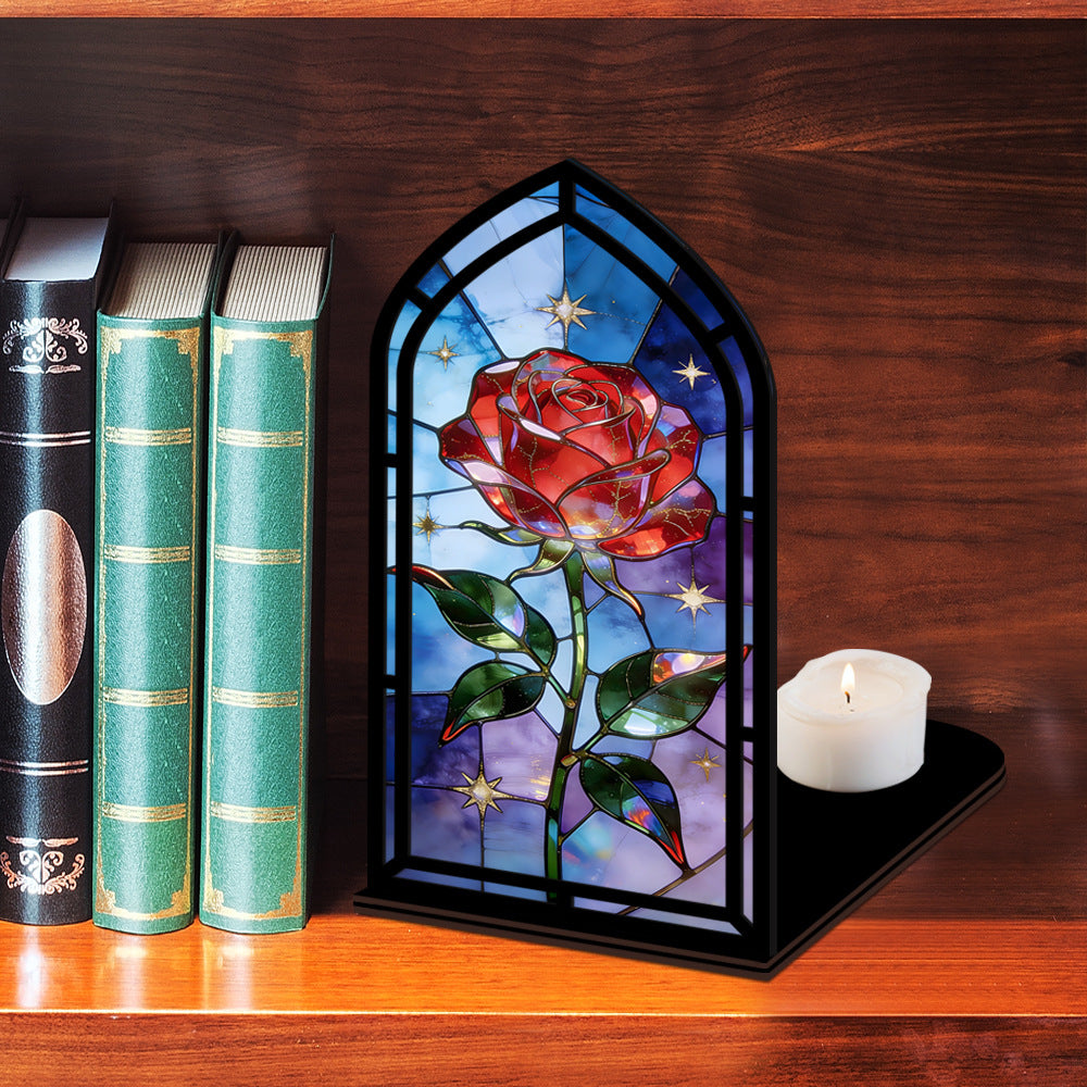 Black arched book nook with stained-glass red rose, candle on the base