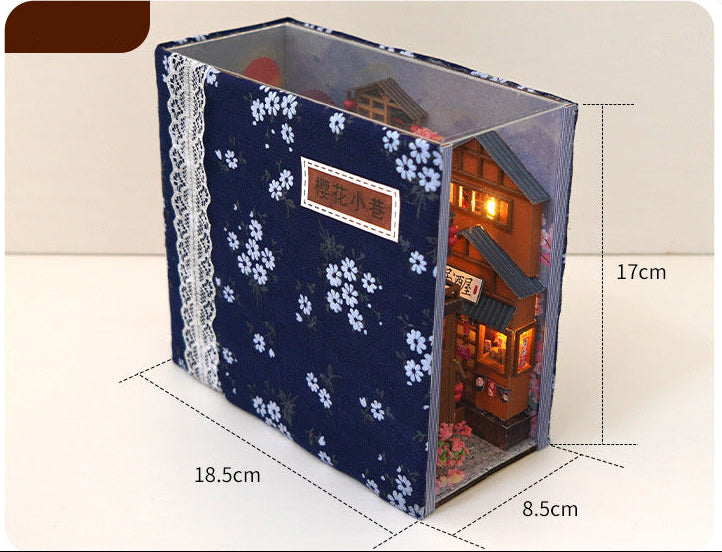 Japanese book nook kit box with dark blue floral fabric and size labels