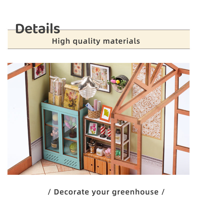 Mini dollhouse interior detail with light blue cabinet, wooden railing, and framed pictures.