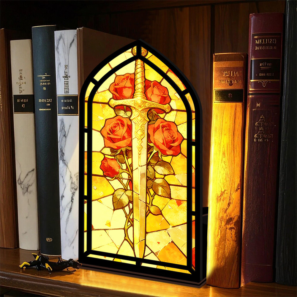 Stained-glass arched book nook with sword and red roses, black frame on shelf