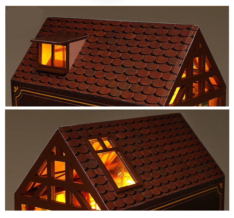 Miniature book nook house roof with warm-lit window accents