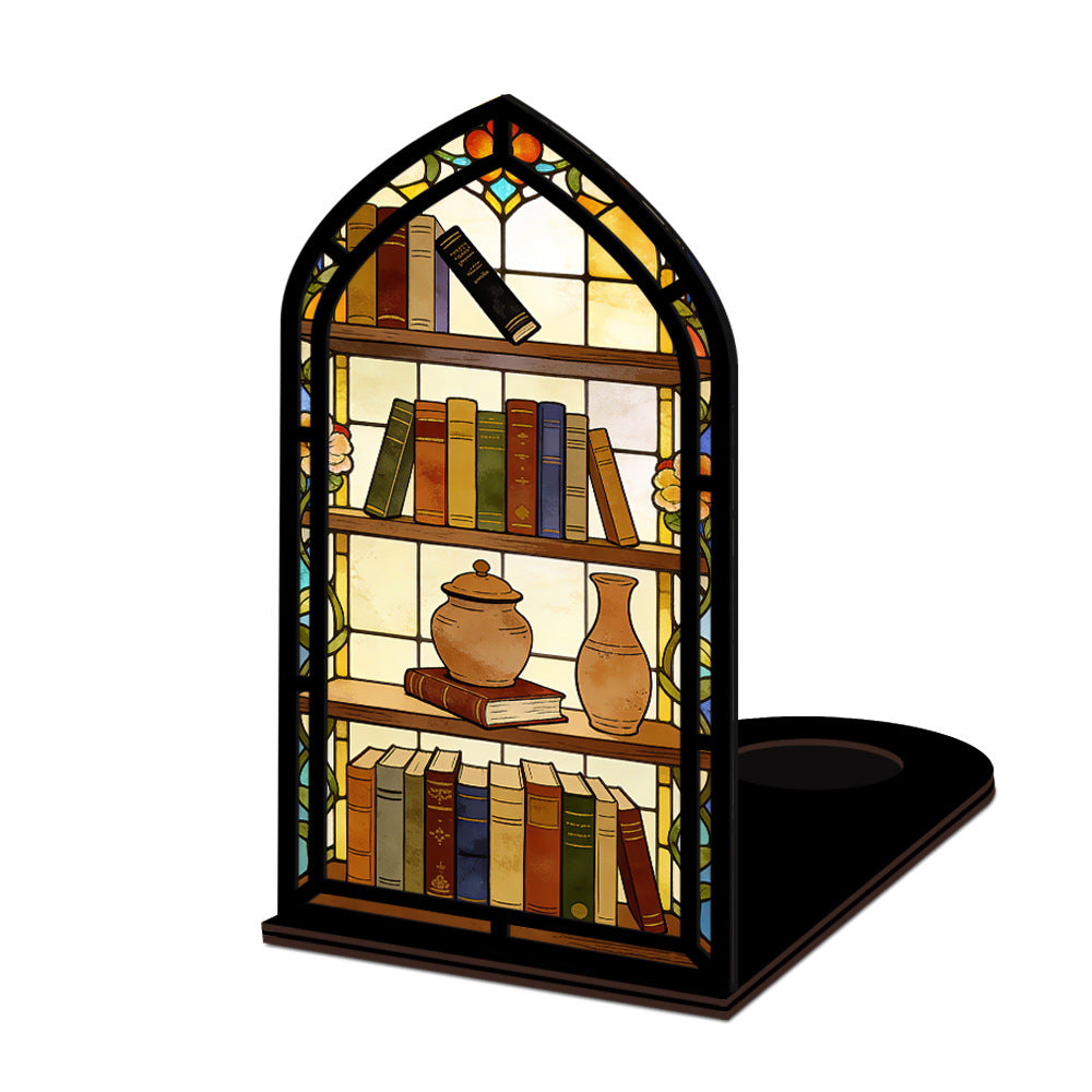 Arched illuminated book nook display with faux books, teapot, and vase on black base.