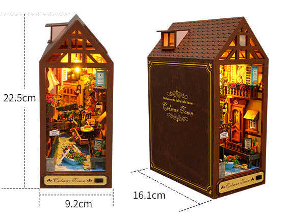 Miniature book nook house display with dimensions shown for height and width
