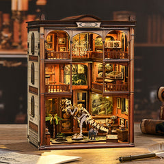 DIY miniature kit building with open-window rooms and dinosaur skeleton model display