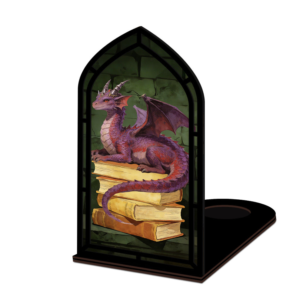 Dragon book nook with black arched frame showing purple dragon on stacked books