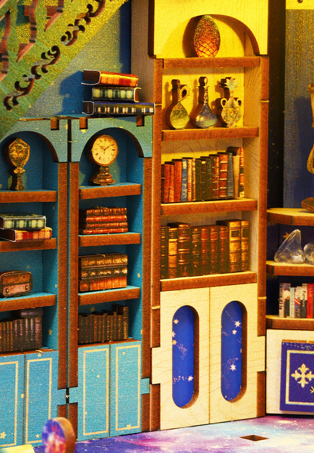Wooden space craft kit interior shelves with books, instruments, and glowing lamps