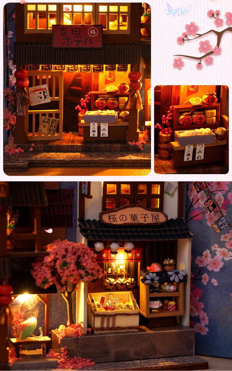 Close-up mini Japanese storefronts with glowing windows and flower details