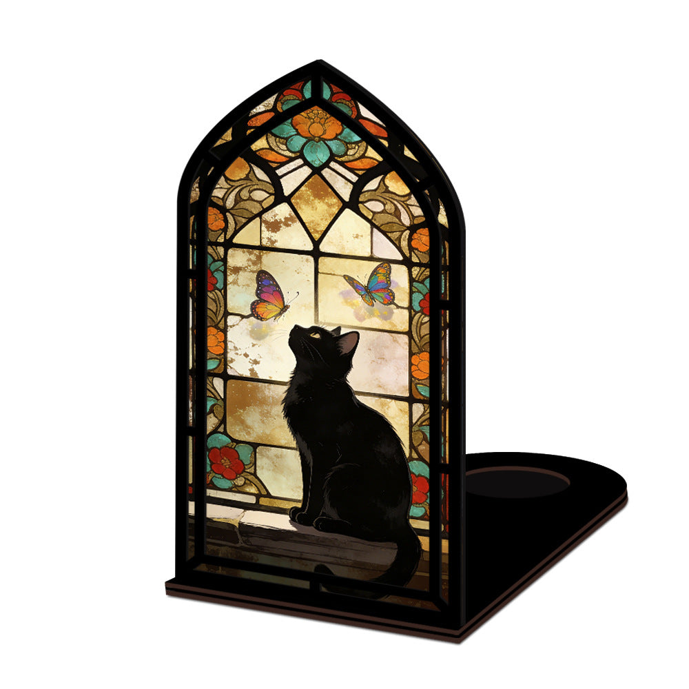 Stained glass arched book nook with black cat silhouette, butterfly window, and candle base