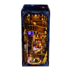 Tall book nook house kit showing lit shelves, potion bottles, and purple glow