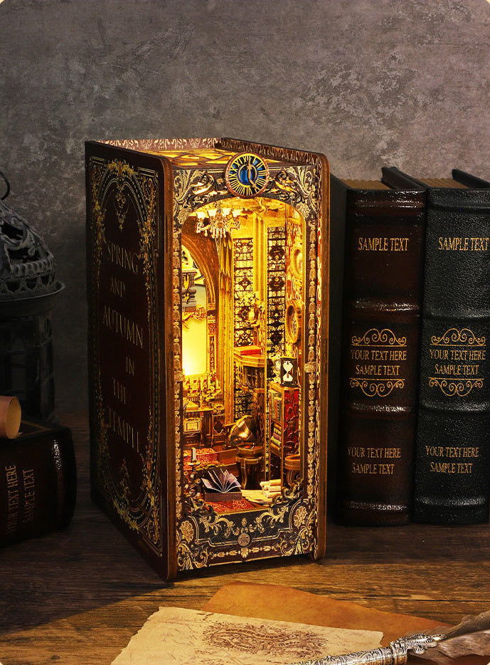 Gothic book nook kit with lit miniature church interior inside an ornate book box