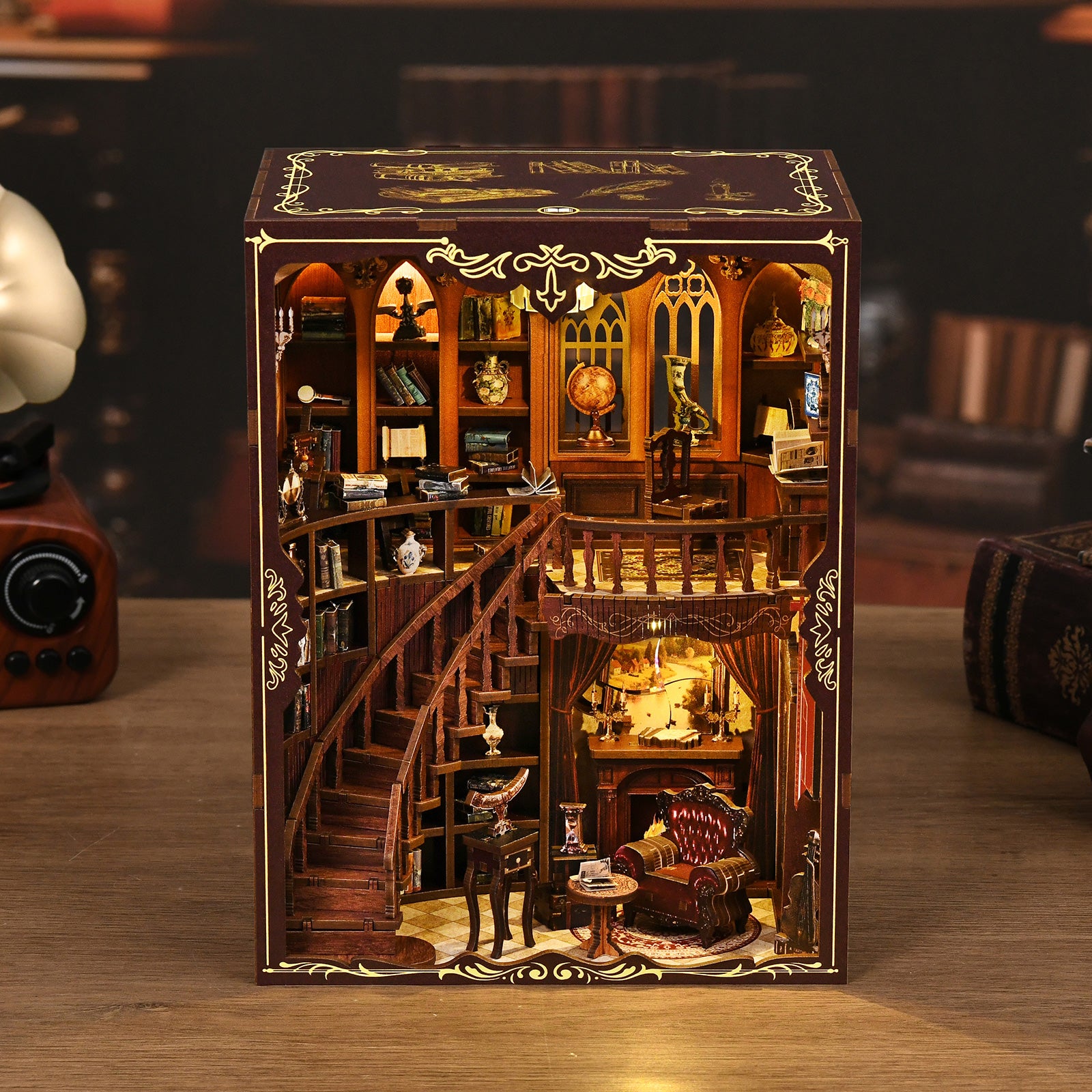 DIY miniatures book nook kit box with warm-lit interior scene on display