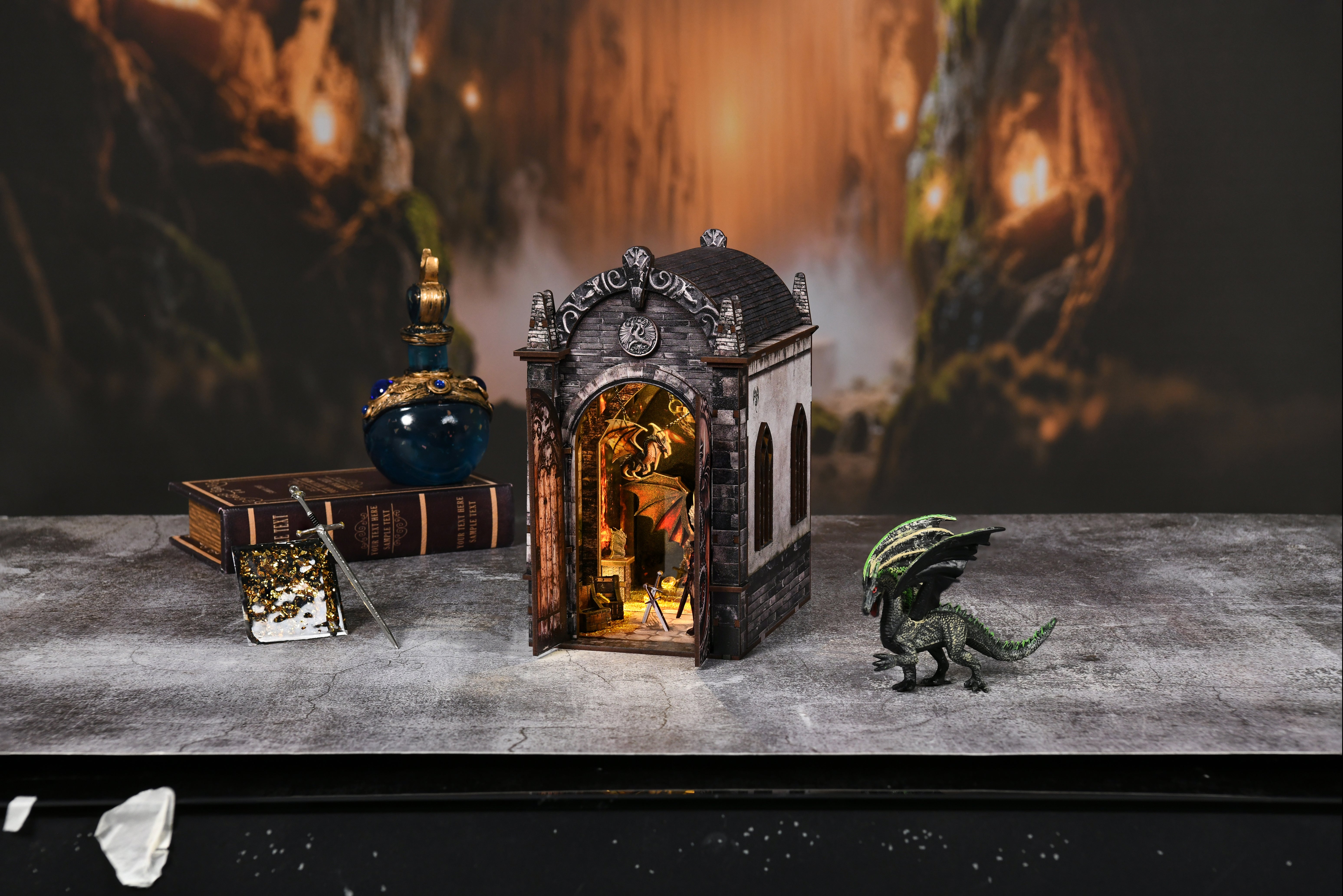 Mini labyrinth display with arched door, glowing interior, and dragon figurine