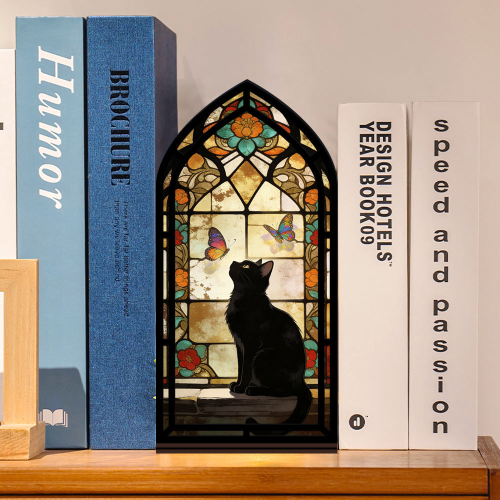 Stained glass arched book nook with black cat silhouette and butterfly window, standing upright
