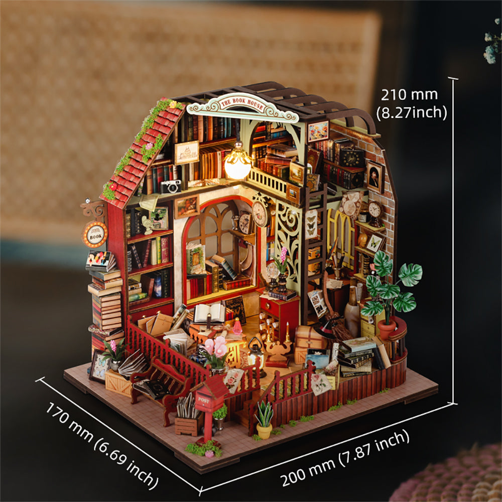 Miniature dollhouse kit with red stairway roof, book shelves, and potted plants on display base