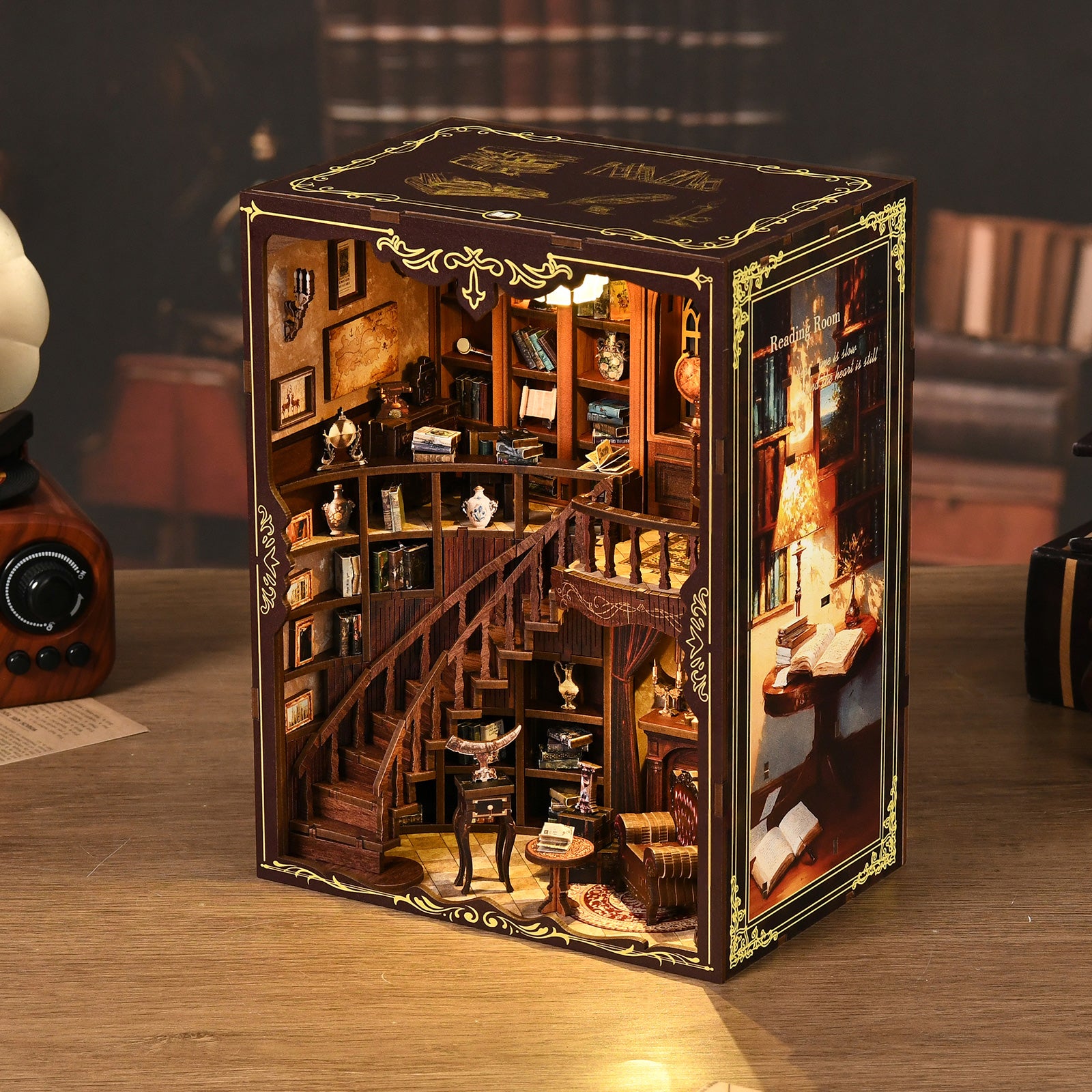 DIY miniature library kit display with detailed wooden interior, furniture, and golden trim