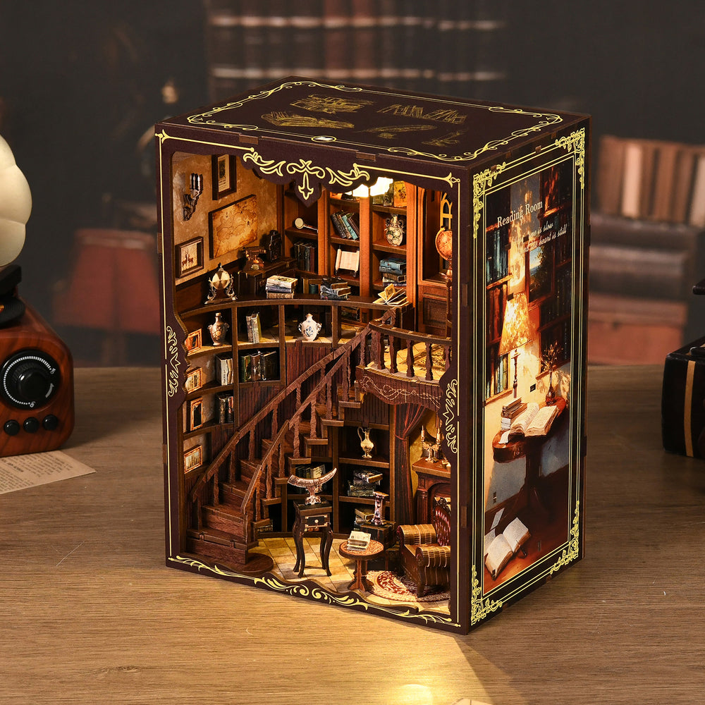 DIY miniature library kit display with detailed wooden interior, furniture, and golden trim