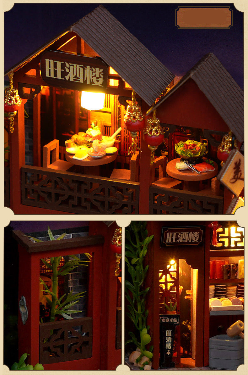 Miniature street food book nook kit, with lantern-lit stalls, tables, and hanging decorations.