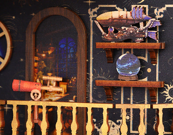 Wooden space craft kit interior vignette with telescope, cannon-like parts, and star accents