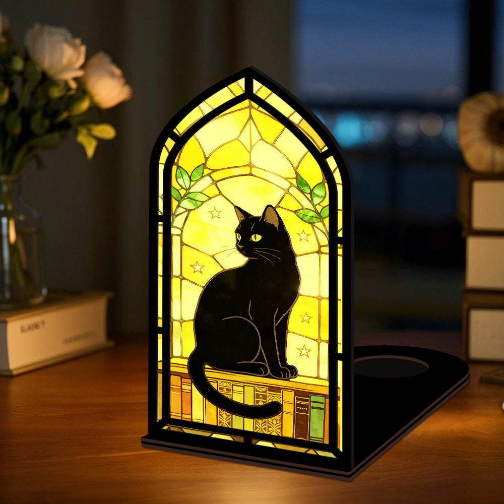Desk display arched black cat book nook with warm glowing light window