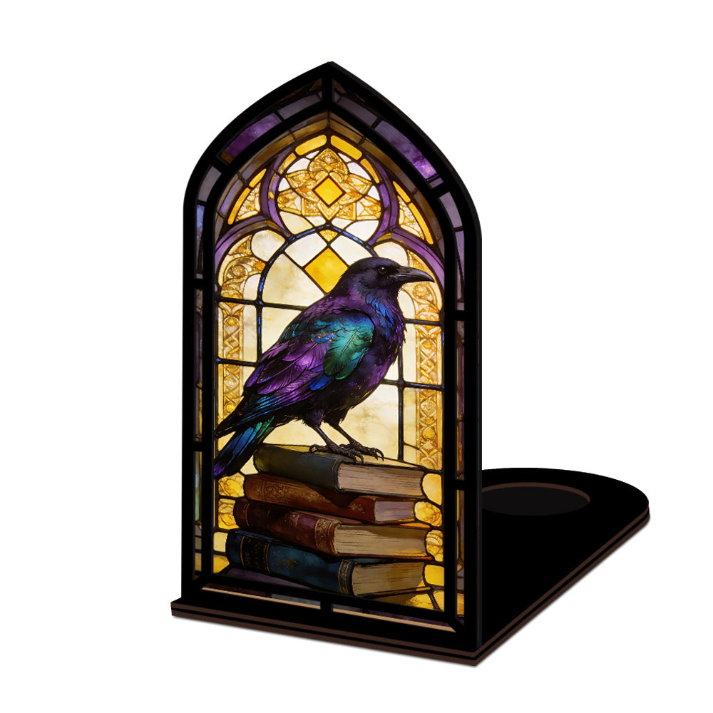Arched book nook with glowing stained-glass raven perched on stacked books, black frame