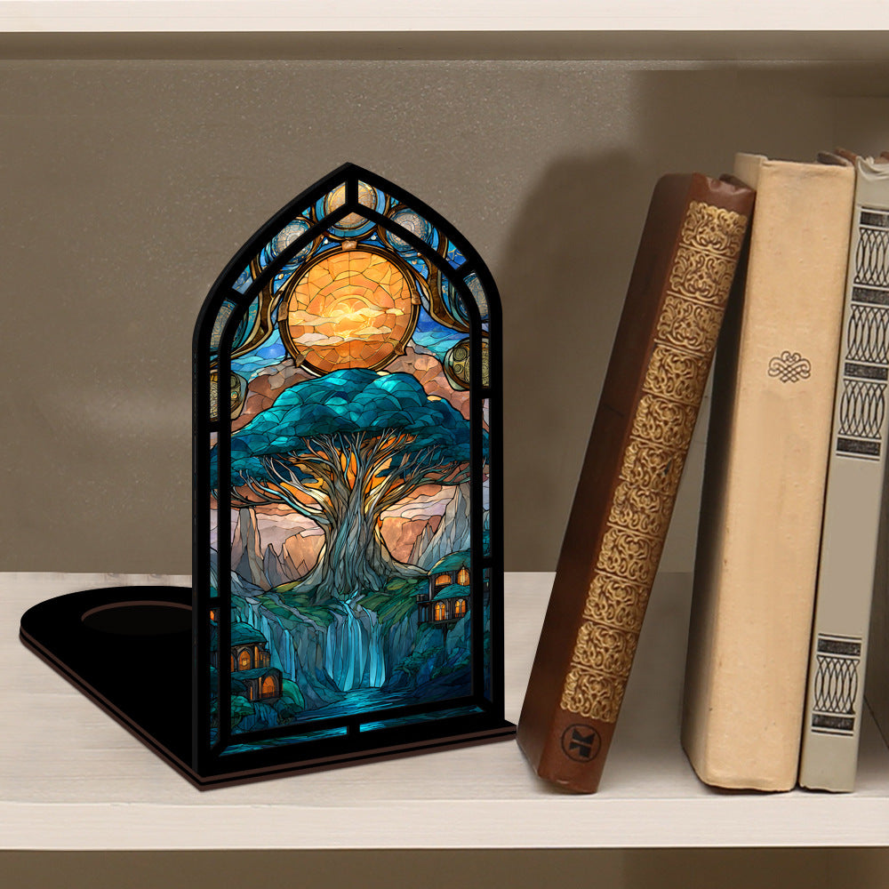 Tree-of-life book nook display with arched stained-glass tree panel on a shelf