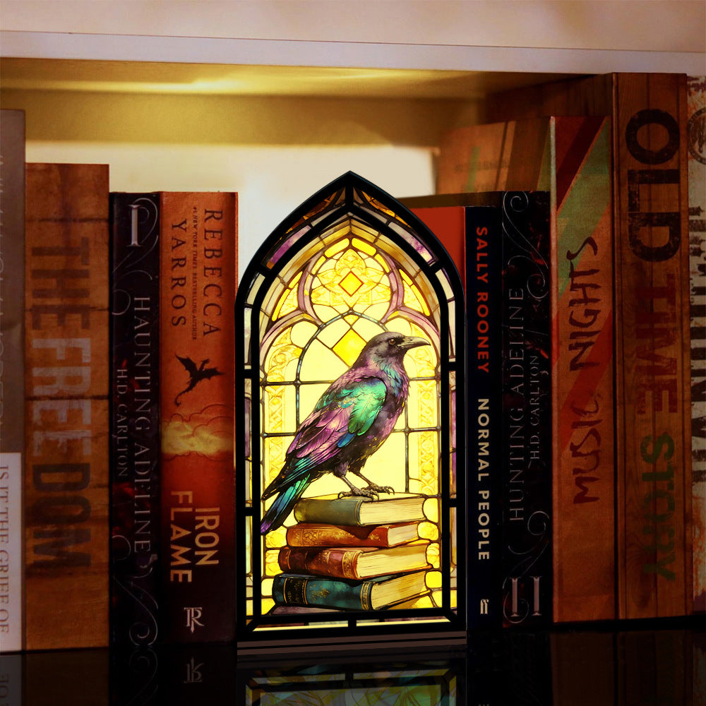 Arched book nook with glowing stained-glass raven perched on stacked books