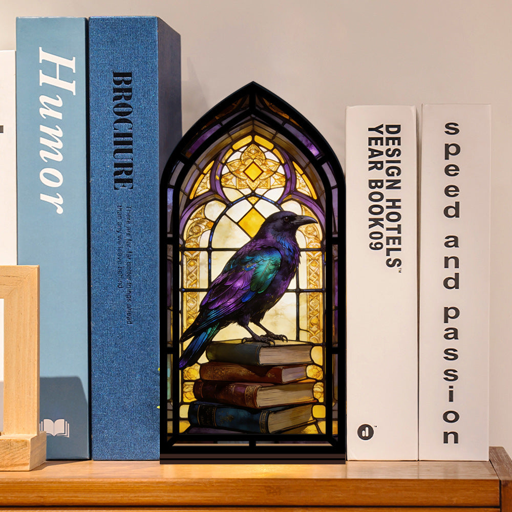 Arched book nook with stained-glass raven artwork and warm candle glow over stacked books