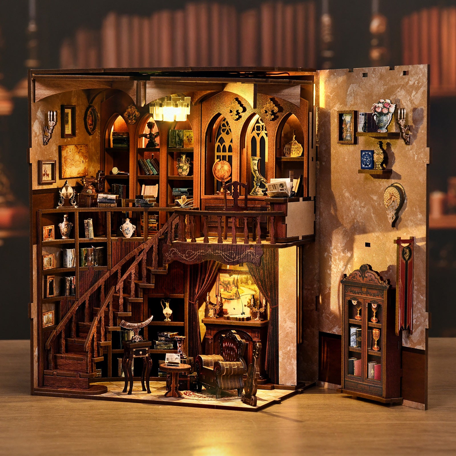 DIY miniature library kit with multi-level interior shelves, desk, and arched rooms