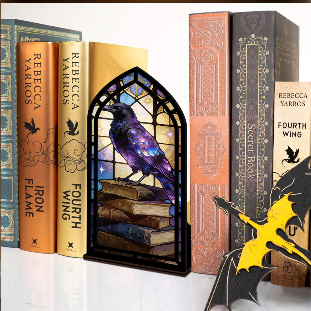 Arched book nook candle display with purple raven on stacked books