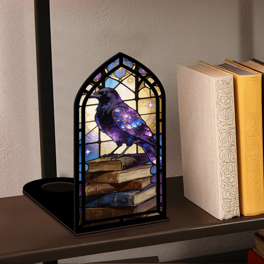 Arched book nook candle display with purple raven on stacked books