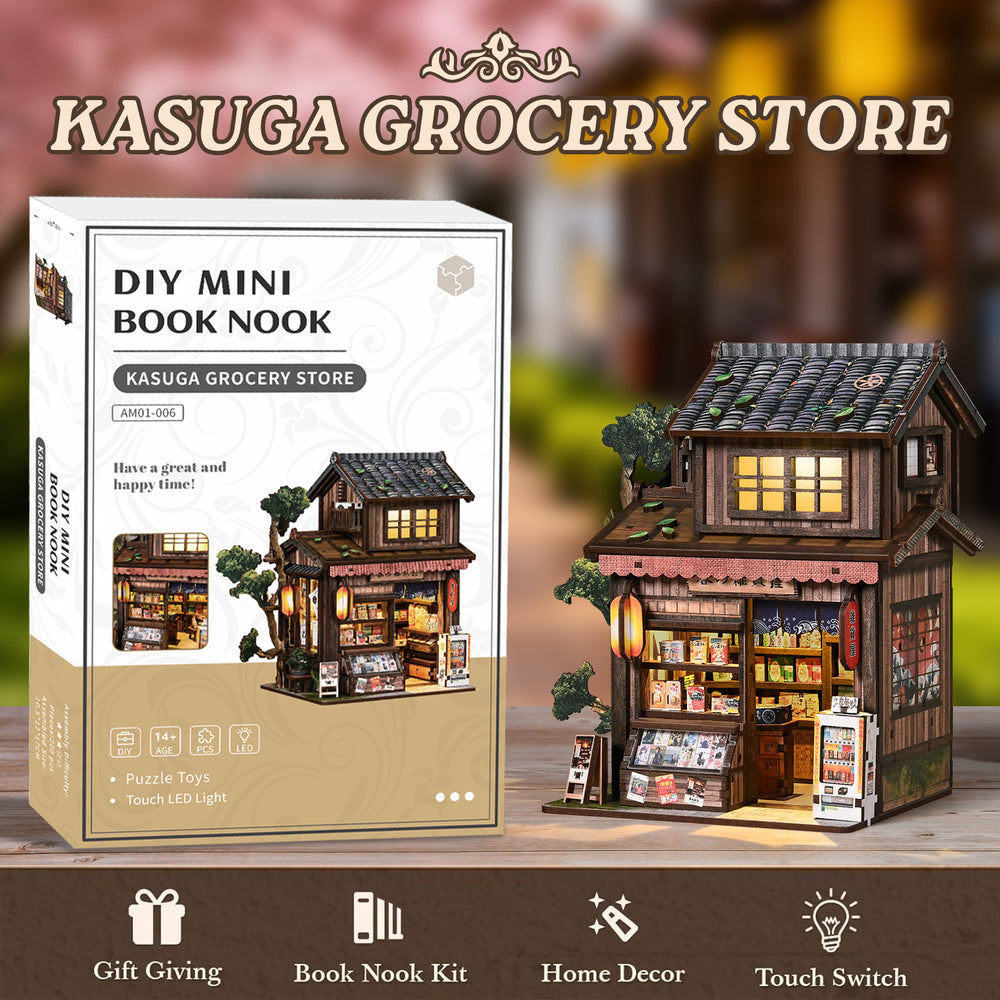Miniature grocery store kit with box, showing small illuminated wooden shop facade