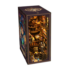 DIY book nook kit display cube with front view of lit shelves and tiny figures
