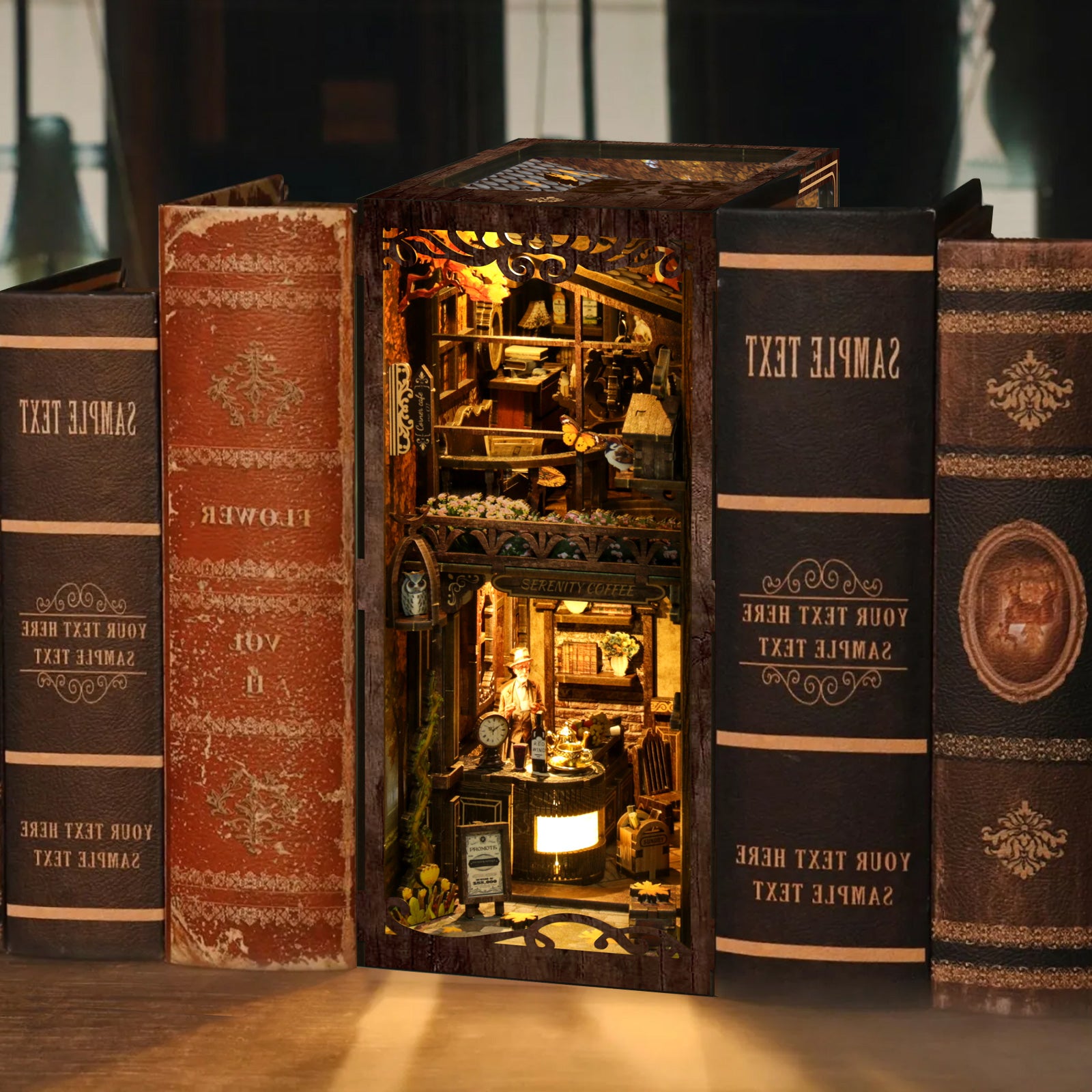 A miniature diorama of a small shop or store, constructed from books, with various objects and decorations inside the open book.
