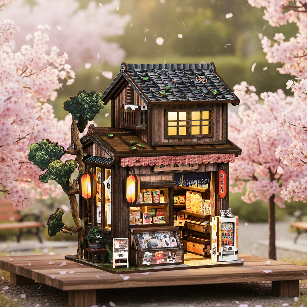 Illuminated miniature grocery store model with tiled roof and open shelves