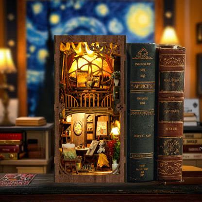 A miniature wooden dollhouse with a cozy interior, illuminated by a lamp, sits on a table next to two large books.