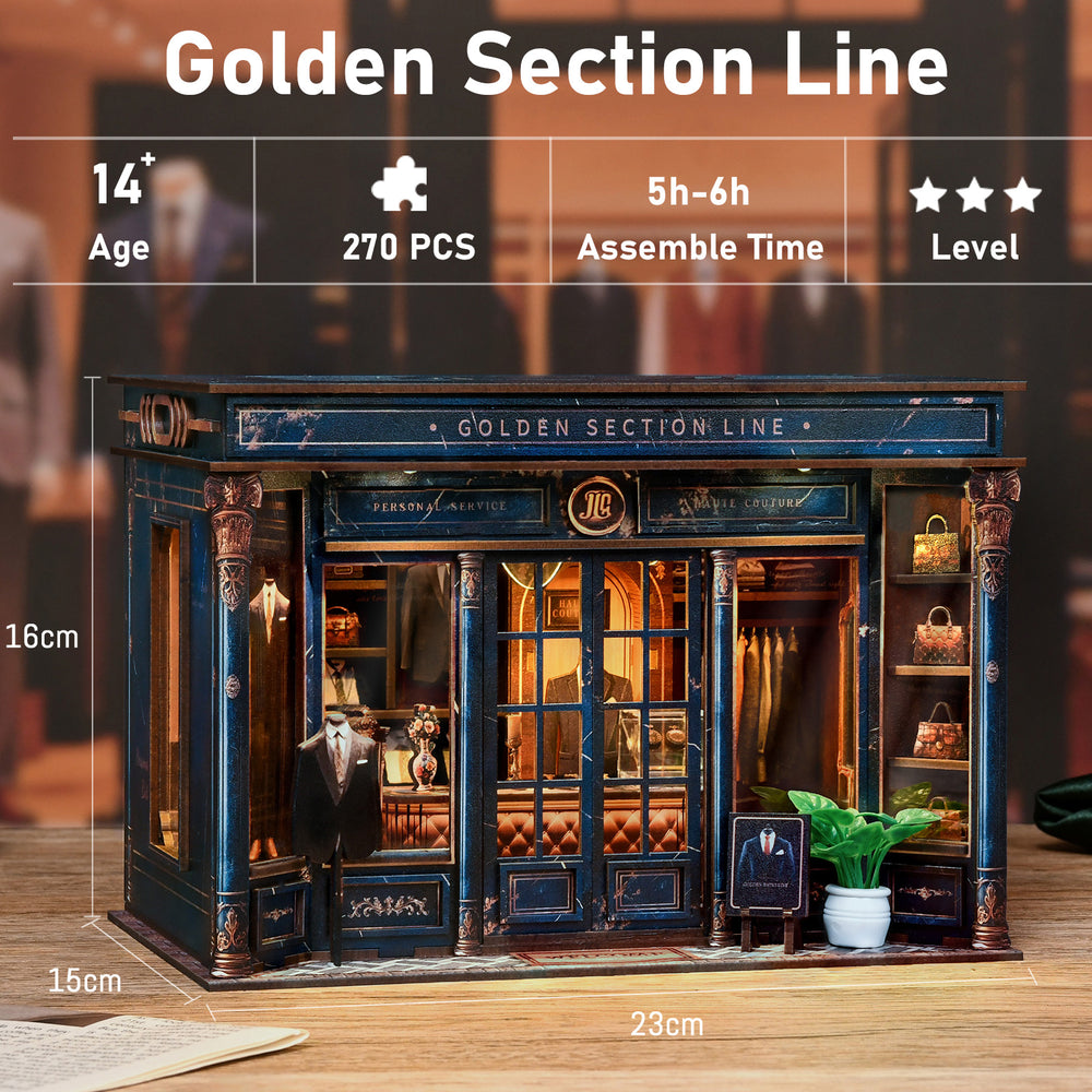 DIY mini dollhouse kit, dark blue facade with gold accents and small potted green plant.