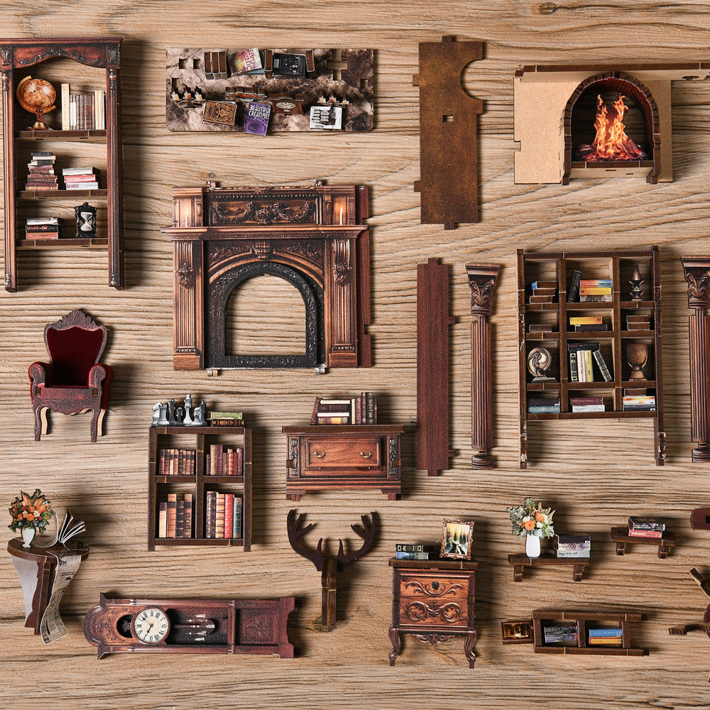 Assorted miniature room furniture and decor pieces arranged on a wooden board