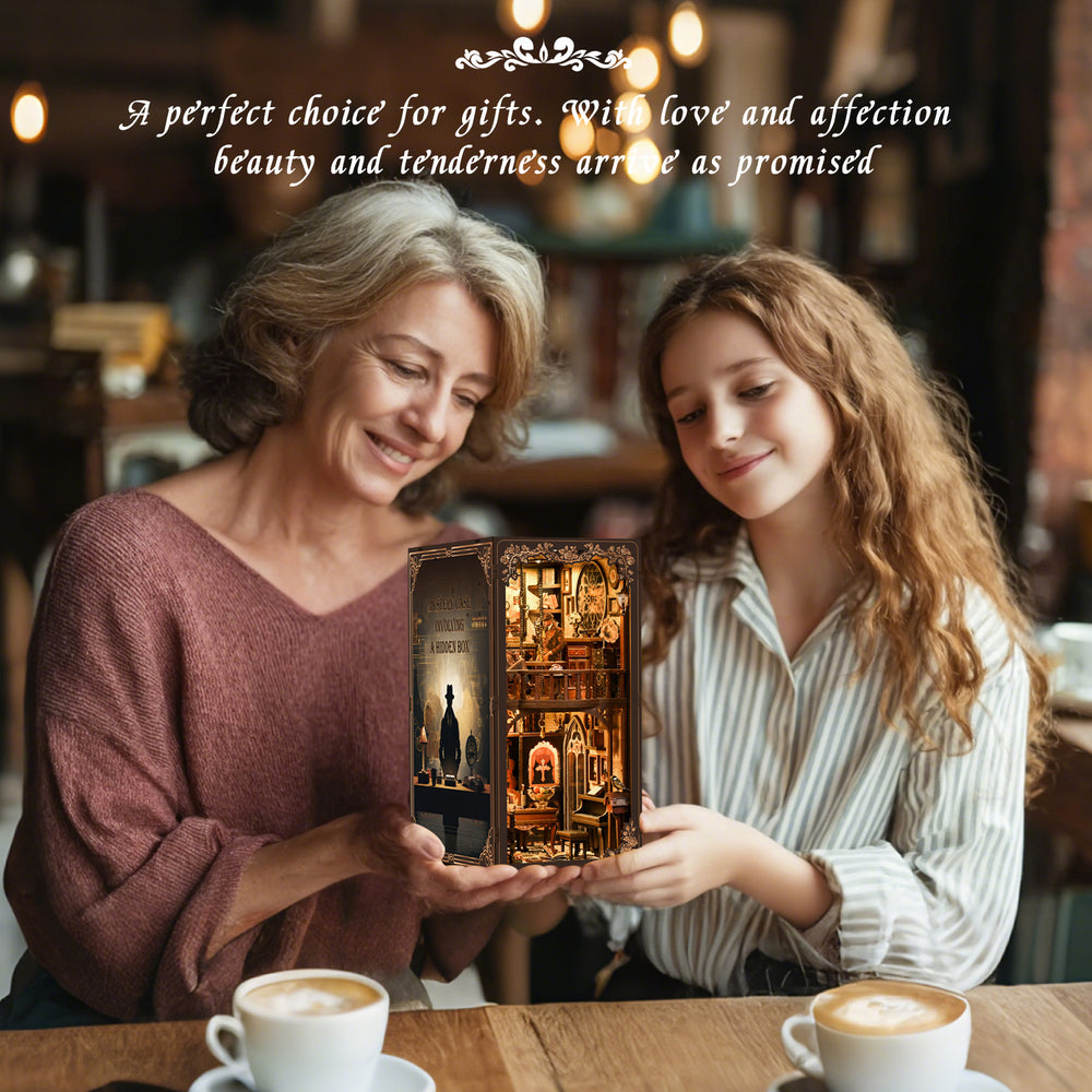 DIY book nook kit box with miniature interior scene, held by two people