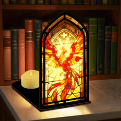 Stained-glass phoenix firebird display with lit candle, black base