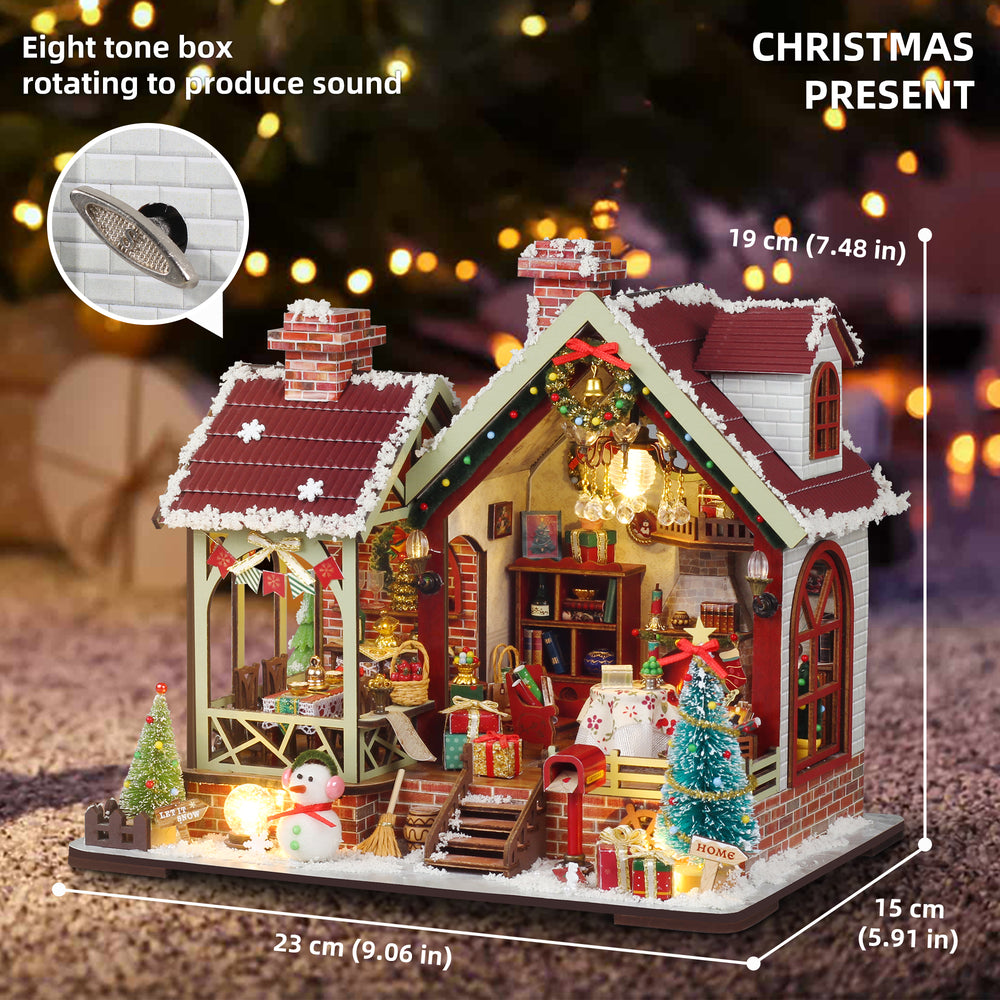 Cozy Christmas miniature dollhouse with lit room, red shutters, and decorated yard