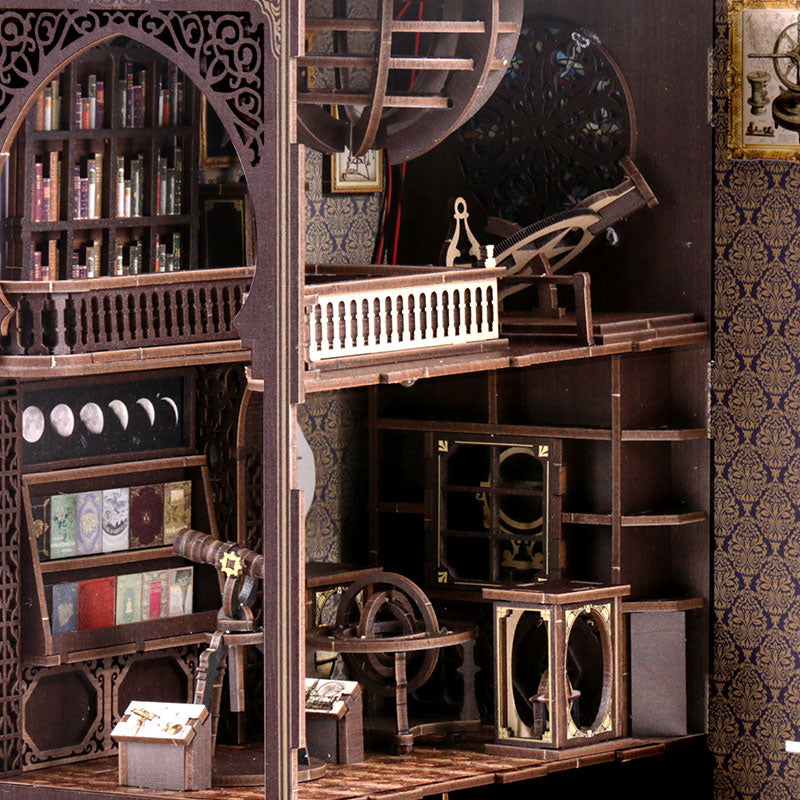 Astronomy DIY book nook kit, close view of interior shelves, telescope rig, and book stands