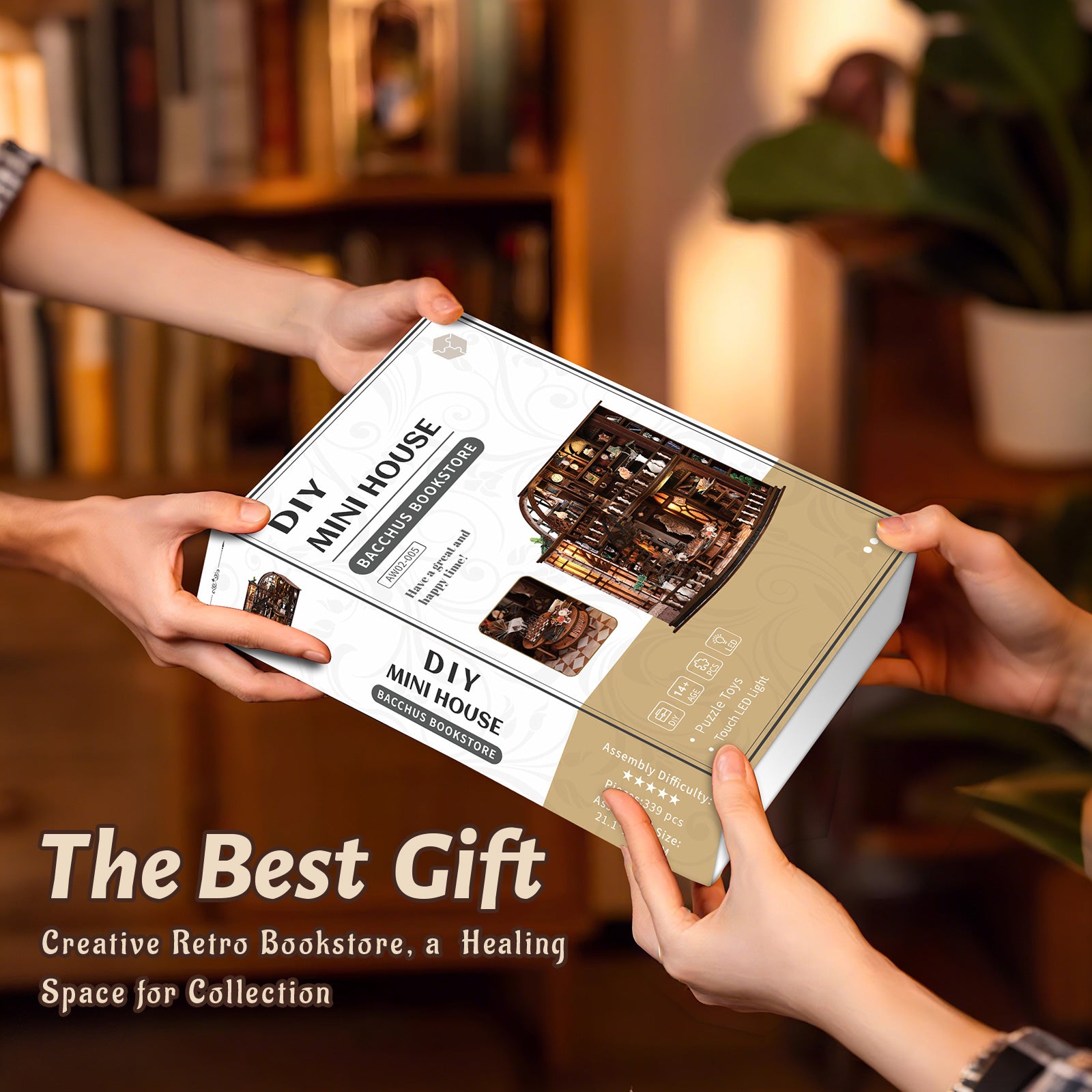 DIY mini house kit box held in hands, featuring a miniature bookstore scene