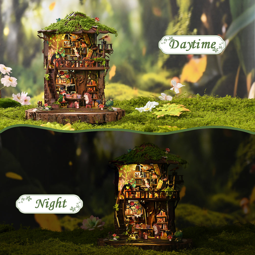 Mini treehouse diorama with warm interior lights and green moss base
