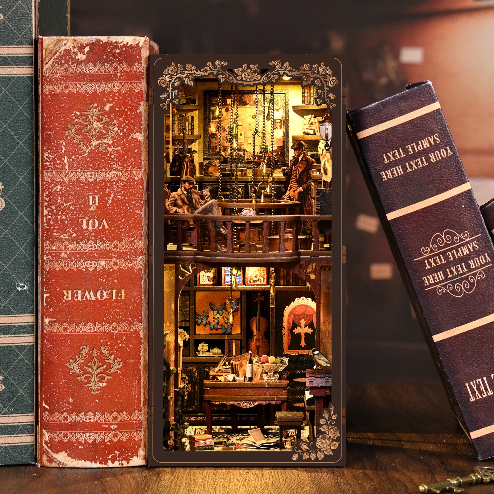 A miniature diorama of a cozy, ornate room with a bookshelf, a fireplace, and a small table with a lamp, displayed between two old, worn books.