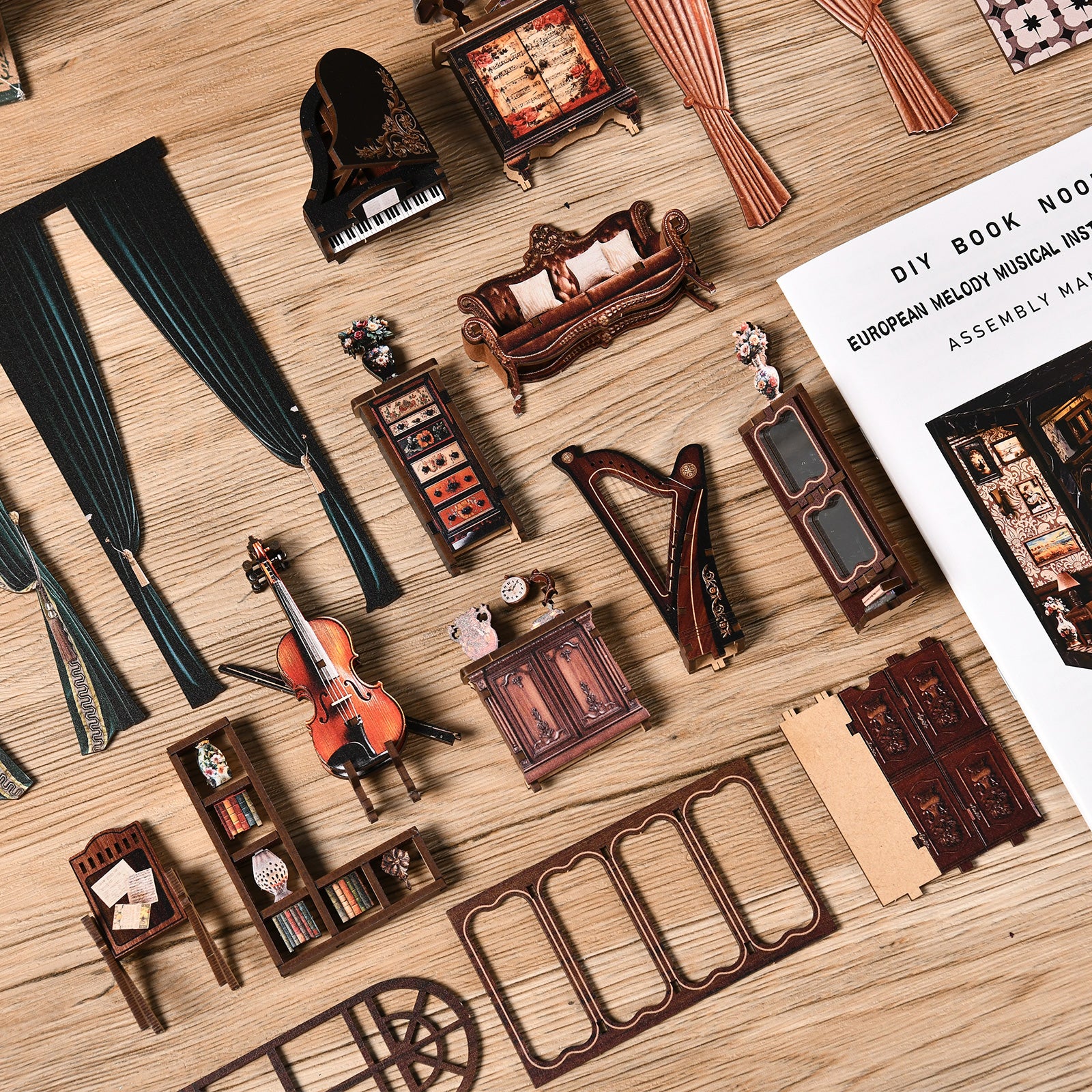 Miniature wooden instrument room parts and accessories arranged on a tabletop