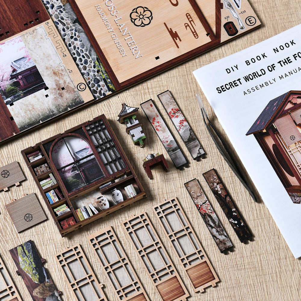 Mini book nook assembly parts with wall panels, frames, and instruction sheets