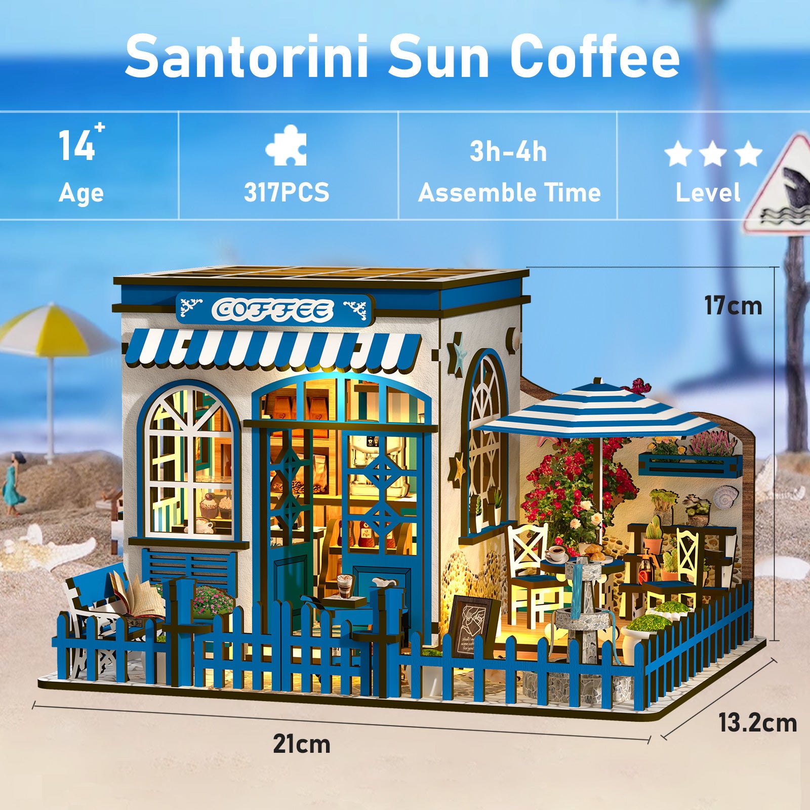 The image is a detailed miniature model of a Santorini Sun Coffee shop, featuring a blue and white color scheme, a patio with an umbrella, and various furniture and decor elements. The model is 17 centimeters tall and 13.2 centimeters wide.