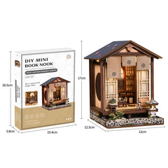DIY mini book nook kit shown with retail box and assembled wooden house with lantern