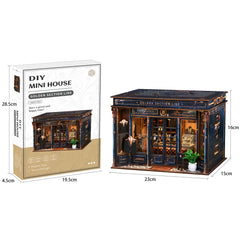 DIY mini dollhouse kit in printed box, showing dark blue miniature house model.
