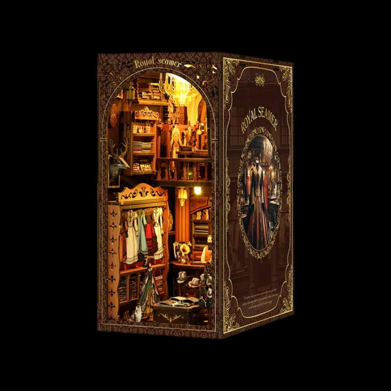 The image is a detailed miniature diorama depicting a small shop or room with various items and decorations, including clothing, books, and other knick-knacks.